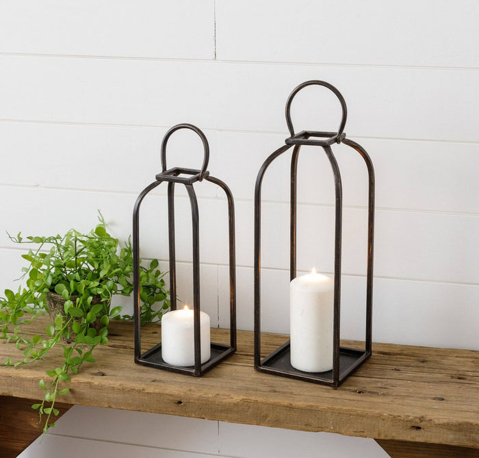 Close-up of arched black open metal lanterns detail from Magnolias Home Decor