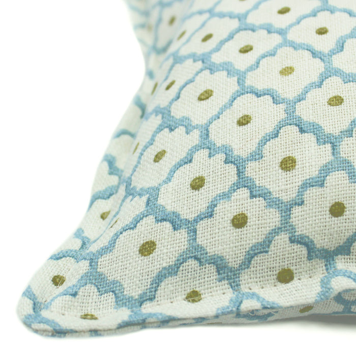 A blue, yellow and cream linen cushion with a trellis pattern.