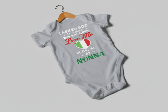 Gray baby onesie with text and colors on a gray background