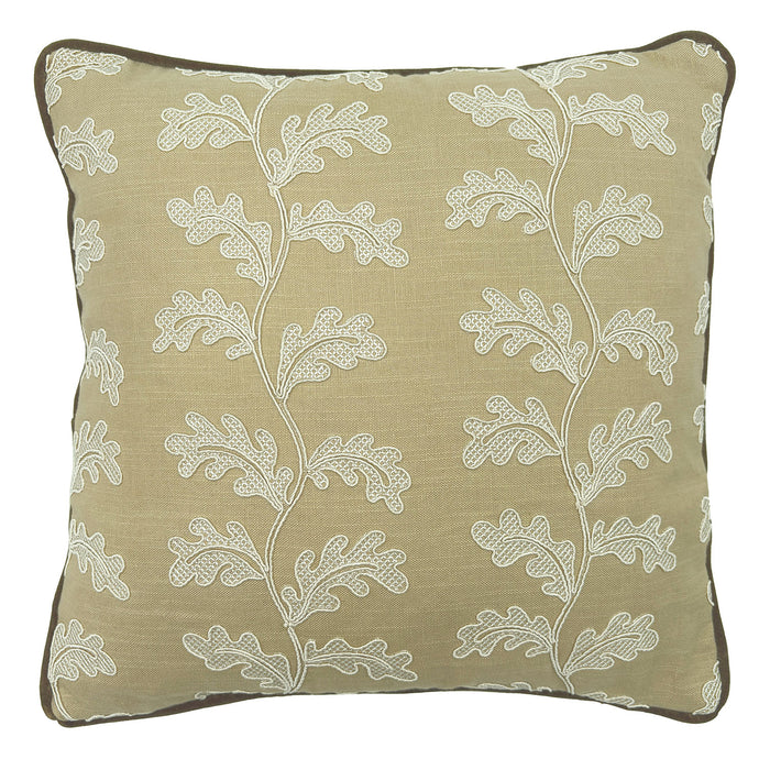 Decorative sand coloured cushion with a off-white leaf pattern.