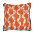 A orange, cream and blue linen cushion with a all-over repeat pattern and velvet piping.