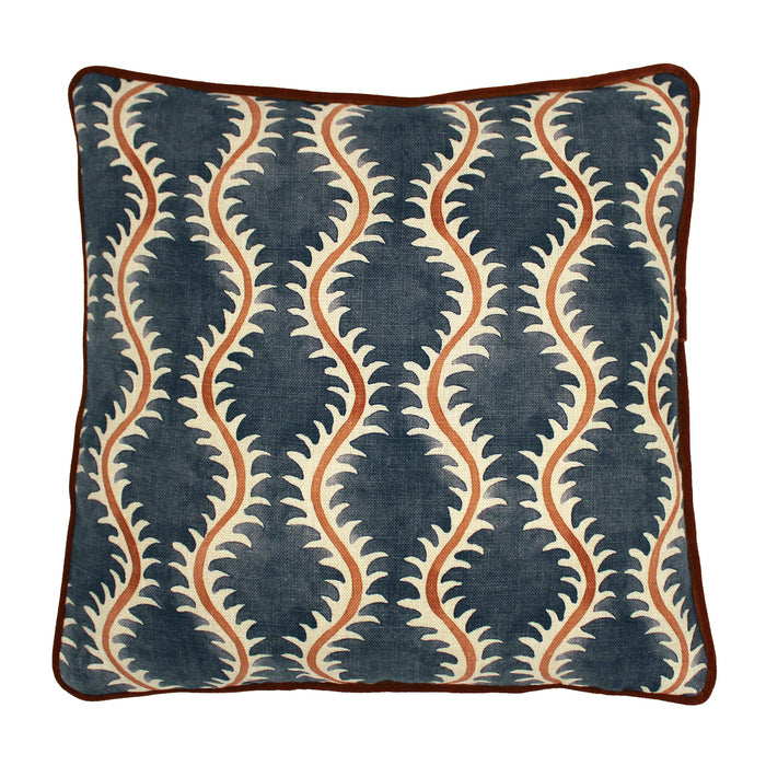 A blue, orange and cream linen cushion with a all-over repeat pattern and linen piping.