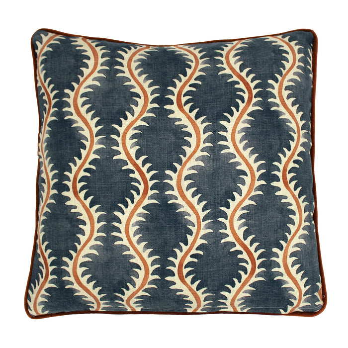 A blue, orange and cream linen cushion with a all-over repeat pattern and linen piping.