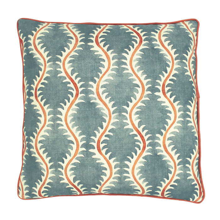 A blue, orange and cream linen cushion with a all-over repeat pattern and linen piping.