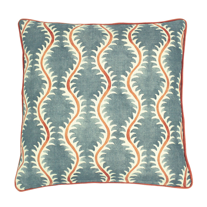 A blue, orange and cream linen cushion with a all-over repeat pattern and linen piping.