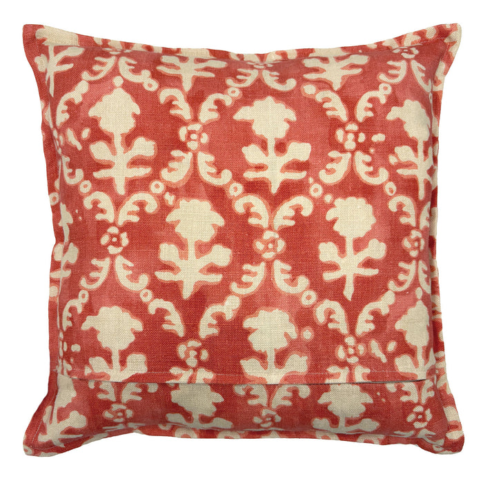 Decorative pillow with red and white floral pattern on a white background
