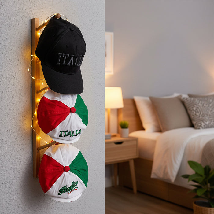 Two hats with 'ITALIA' text on a wall with string lights, bedroom in the background