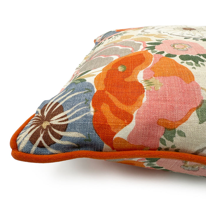 Close-up side view of Linwood cushion in Joni, Tangerine showing fabric texture and piping in a complementary deep orange linen.