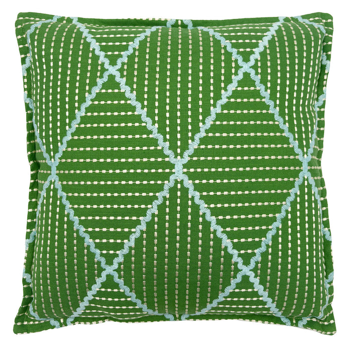 Green cushion with geometric blue pattern.
