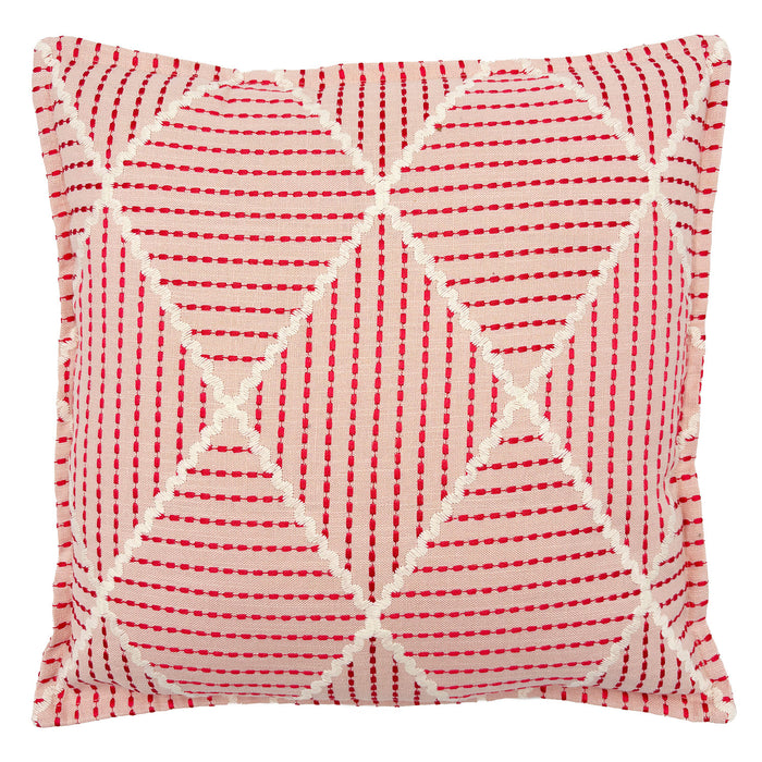 Pink cushion with geometric red pattern.