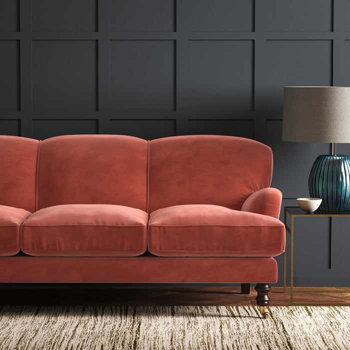 Orange eco velvet upholstery fabric on a sofa