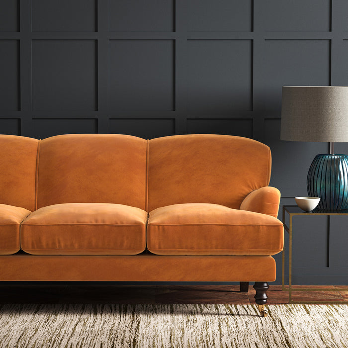 Orange eco velvet upholstery fabric on a sofa