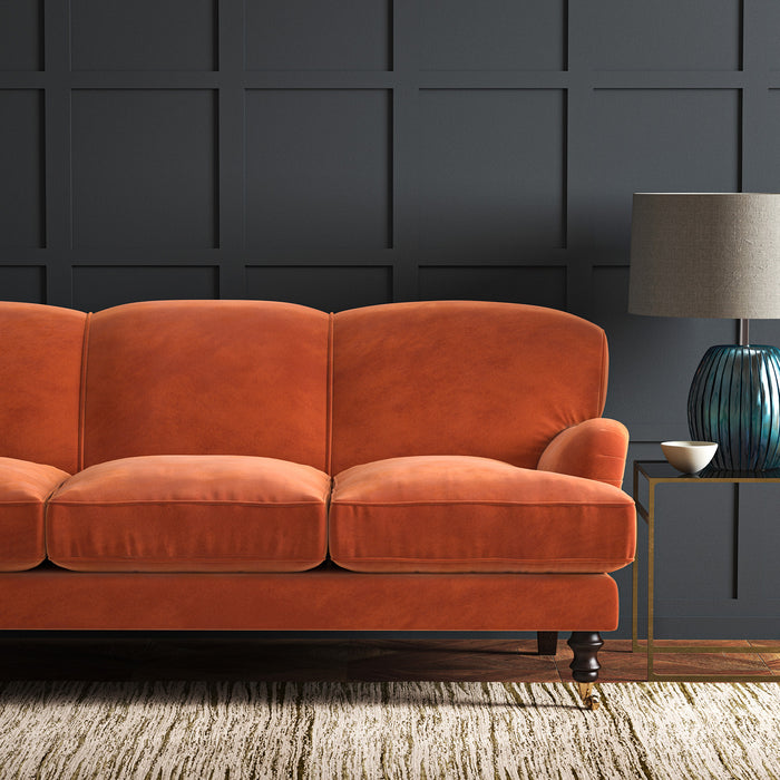 Orange eco velvet upholstery fabric on a sofa