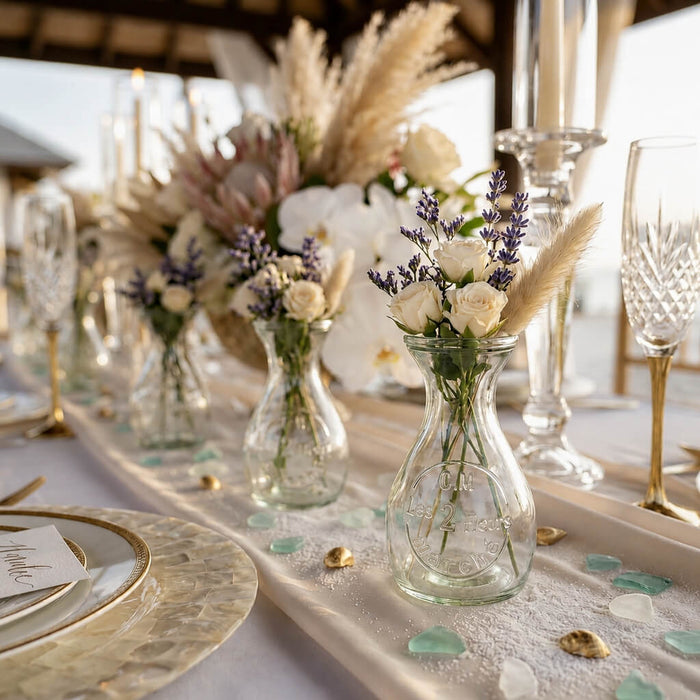 Clear Teardrop Glass Bud Vases with flowers on a wedding table