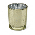 An empty Metallic Gold Mercury Votive Holder isolated from an angle on a clean white background