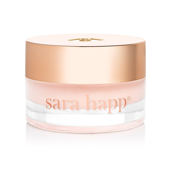Jar of sara happ lip balm with a gold lid on a white background
