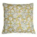 A yellow, blue and cream linen cushion with a block print pattern.