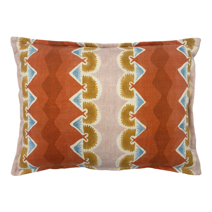 Decorative cushion with geometric pattern in rust, blue and ochre.