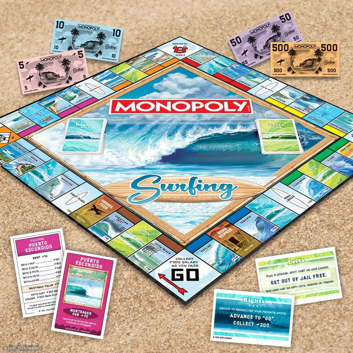USAopoly Monopoly Surfing board game set on a beige surface with cards and pieces.