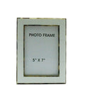 Elegant 5x7 white picture frame with a subtle gold border, perfect for tabletop or wall display.