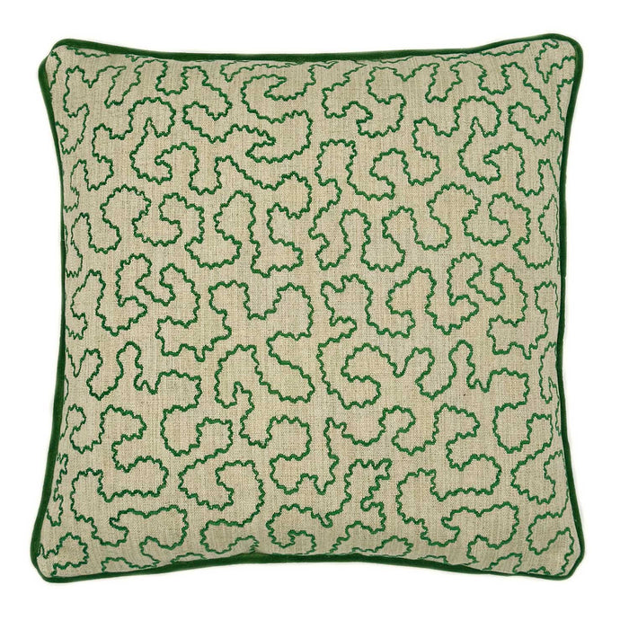A green and off white woven cushion featuring a wavy pattern with a velvet piping.