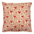 Decorative cushion with a red and pink floral pattern.