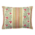 Decorative cushion with floral patterns and stripes on a off-white background.