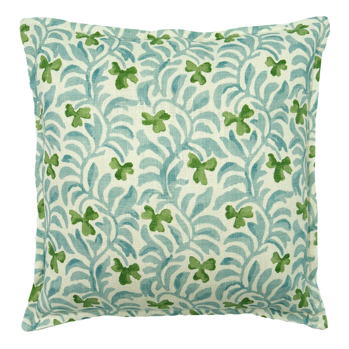 Decorative cushion with a pale blue and green floral pattern.