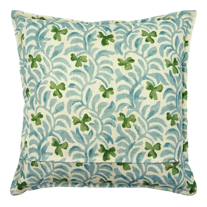 Decorative cushion with a pale blue and green floral pattern.